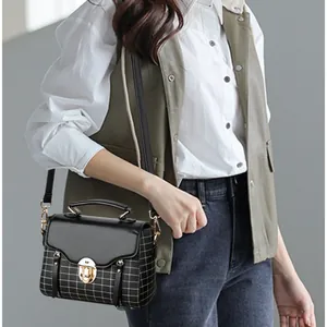 Retro plaid patchwork crossbody bag with gold twist lock and adjustable shoulder strap