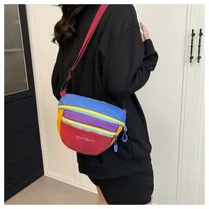 Close-up of vibrant multi-color patchwork nylon chest bag with adjustable red strap