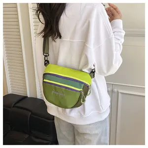 Detail of waterproof nylon waist bag showing multicolor patchwork and high-quality stitching