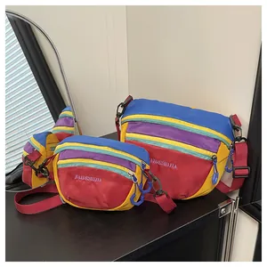 Close-up of colorful waterproof nylon crossbody bags with durable red shoulder straps