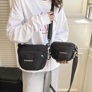 Waterproof black nylon waist bag set with multiple zippers in two sizes for outdoor sports