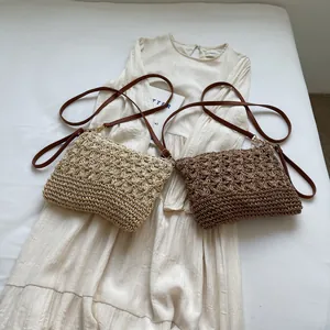 Large woven beach tote bag in beige and brown styles with adjustable leather shoulder straps