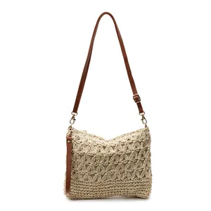 Large woven beach tote bag in cream white with brown adjustable leather straps