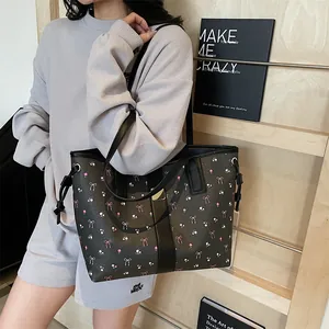 Large floral tote bag with pink flowers and gold buckle, stylish commuter shoulder bag