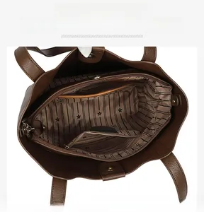Internal view showing inner slip pocket, zippered compartment, and flower pattern lining
