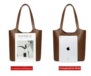 Brown leather tote bag size comparison with an A4 magazine and an iPad device