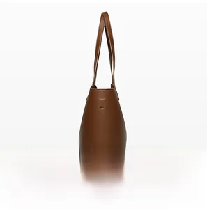 Side view of dark brown tote bag with premium lychee grain leather texture