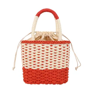 Zomerse geweven emmer tas met oranje en beige contraststiksels en trekkoordsluiting
