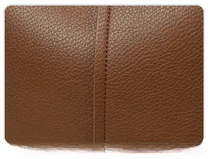 Close-up of neat stitching craftsmanship on brown lychee grain leather tote bag