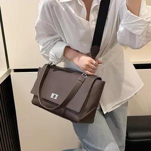 Minimalist caramel leather square handbag with litchi texture and silver swivel lock