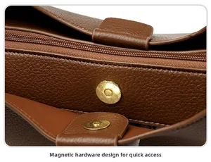 Detail of vintage brown leather tote with secure gold magnetic buckle and zipper closure