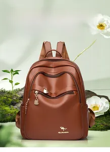 Close-up of brown leather backpack featuring a metal kangaroo logo and multi-zipper detail
