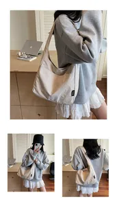 Three-view detail of a beige minimalist canvas tote bag showing the side logo and wide strap