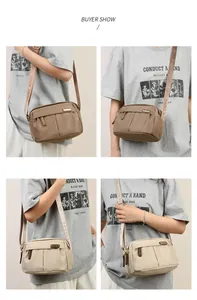 Detail view of khaki and beige waterproof nylon crossbody bags with adjustable straps