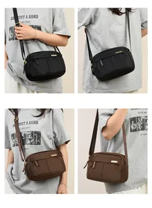 Detail view of large capacity nylon crossbody bag with multi-zipper and jacquard strap