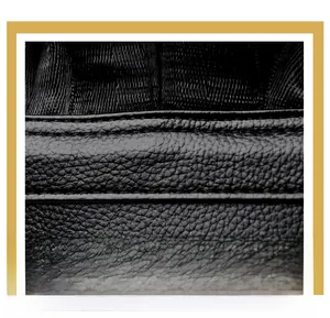 Close-up of durable lychee grain leather texture and premium double stitching detail