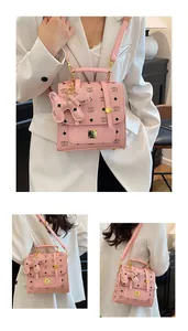 Detail of pink PU leather mini backpack with letter print and golden hardware