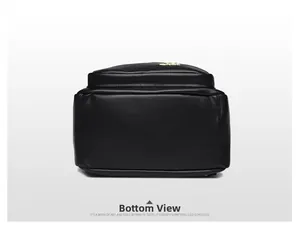 Detailed bottom view of black lychee grain leather backpack with sturdy stitching
