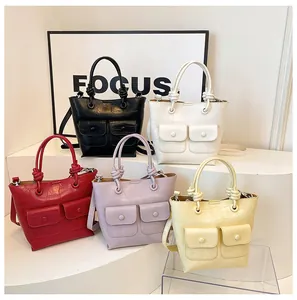 Collection of small crocodile texture handbags in five colors with knot handle detail