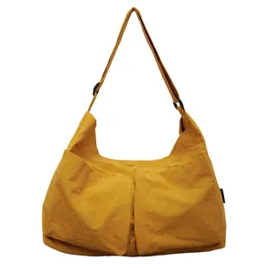 Yellow large capacity nylon crossbody bucket bag with double pockets and wide strap