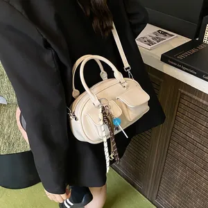 Chic cream white handbag with utility pockets and crossbody strap for women