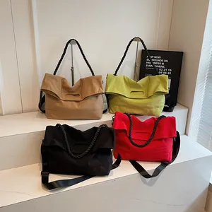 Minimalist canvas tote bags in four colors with thick rope handles and nylon straps