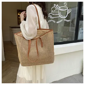Close-up of beige woven tote bag with brown leather straps in a cafe street setting