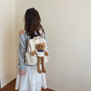 Chic beige canvas backpack with teddy bear prints and a plush bear charm for students