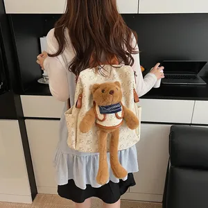 Chic off-white women's backpack with cute teddy bear plush charm and bear patterns