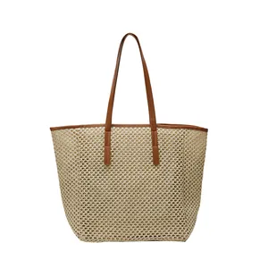 Handwoven straw tote bag with brown leather handles and large capacity summer design