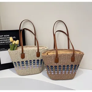 Stylish hand-woven straw tote bags with contrast patterns for beach or daily casual use.