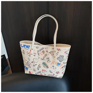 Close-up of bear graffiti tote bag with colorful street art and zipper details