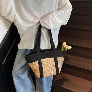 Summer patchwork straw tote bag with black accents and decorative yellow tulips