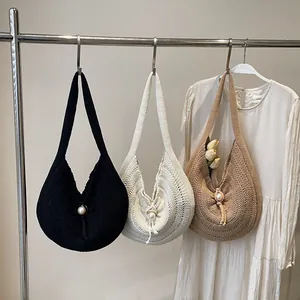 Handmade woven hobo tote bag in black, cream and brown with large pearl button closure