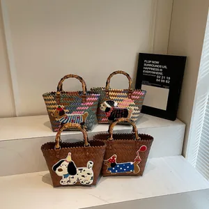 Handwoven tote bags with bamboo handles and cartoon dog embroidery in various styles