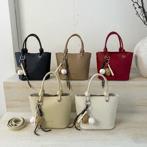 Chic bucket bags in five colors with textured leather and creative baseball charms