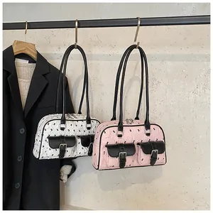 Detailed display of lace bow Boston bags with front pockets and silver metal buckles