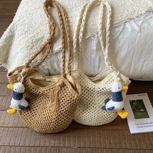 Large cotton woven shoulder bag with hollow mesh design and plush animal pendant