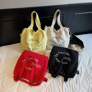 Canvas tote bag in four colors with drawstring closure and stylish letter printing