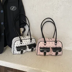 Chic Boston underarm bags in pink and white with lace bow patterns and buckle pockets