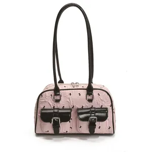 Pink lace textured bow shoulder bag with black trim and dual pockets for women