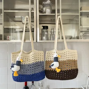 Handmade crochet tote bag with contrast gradient mesh and cute seagull pendant