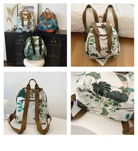 Detail view of large capacity printed backpack with tropical leaf and artistic patterns