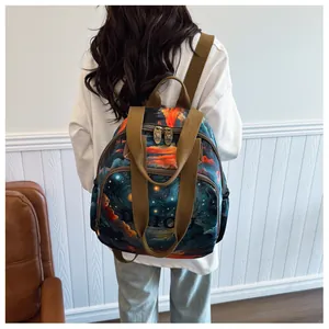 Detail of Starry Night print backpack featuring dual-zipper main pocket and side bags