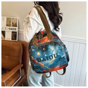 Detail of artistic star pattern backpack with DAIOU lettering and leather strap accents