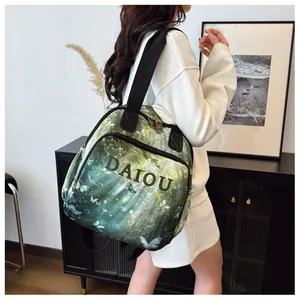 Detailed close-up of DAIOU large capacity backpack with green forest and butterfly print
