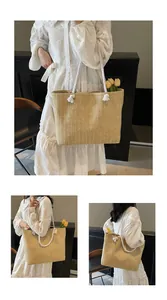 Detailed macro view of large woven straw tote bag with cotton rope handles for summer beach