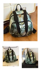Macro view of forest green printed backpack with DAIOU logo and metal zipper details