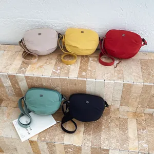 Set of five colorful nylon shell bags with adjustable straps in macaron shades
