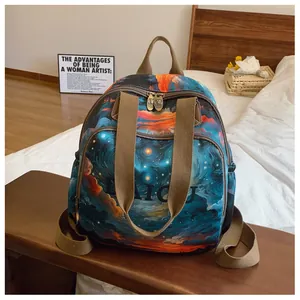 Detailed shot of artistic oil painting print backpack with cat-head metal zipper pullers